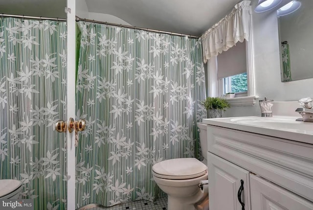 bathroom featuring vanity, a shower with curtain, and toilet