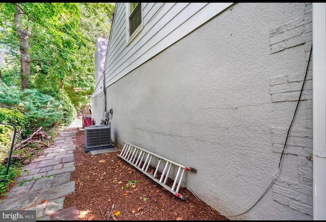 view of home's exterior featuring central AC unit