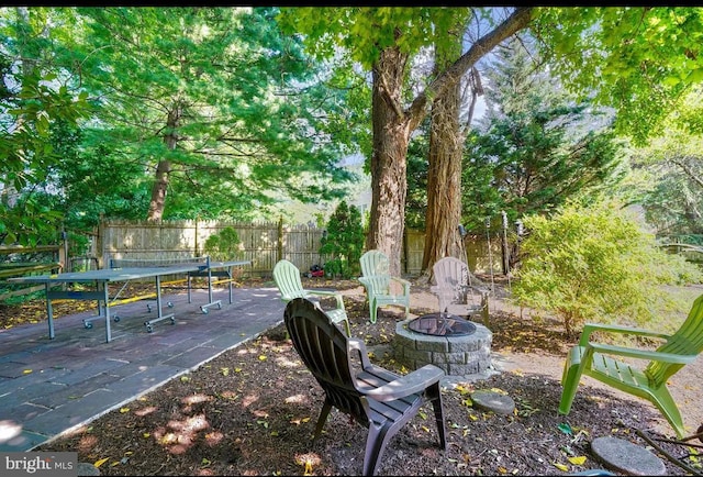 view of patio / terrace featuring a fire pit