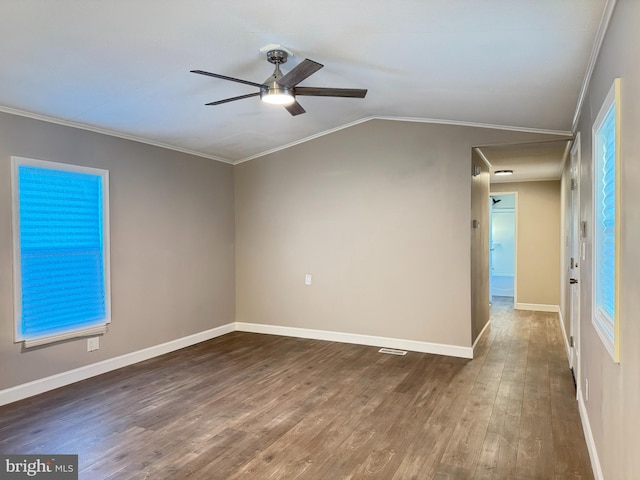 unfurnished room with ornamental molding, lofted ceiling, ceiling fan, and dark hardwood / wood-style flooring