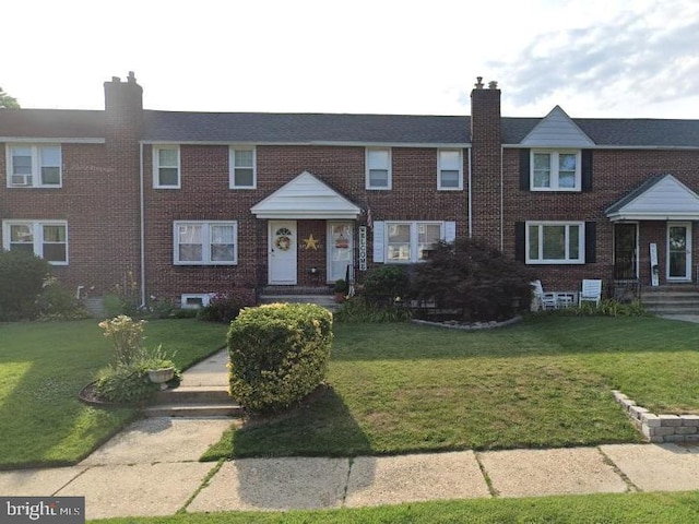 view of property featuring a front yard