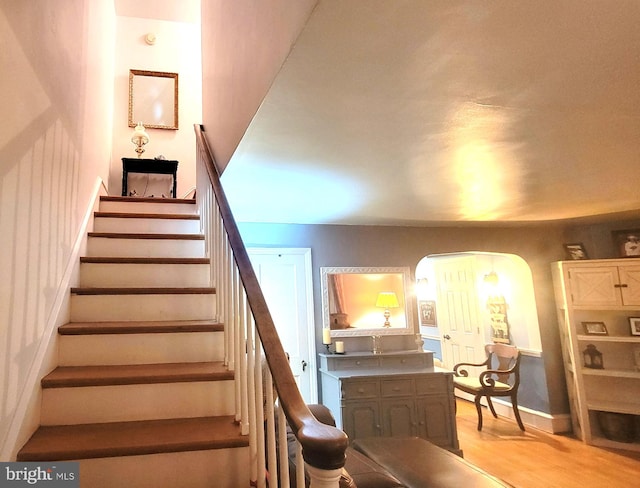 staircase featuring hardwood / wood-style floors