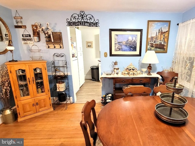 dining space with light wood-type flooring