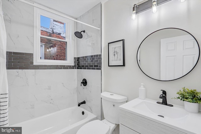 full bathroom featuring tiled shower / bath combo, vanity, and toilet