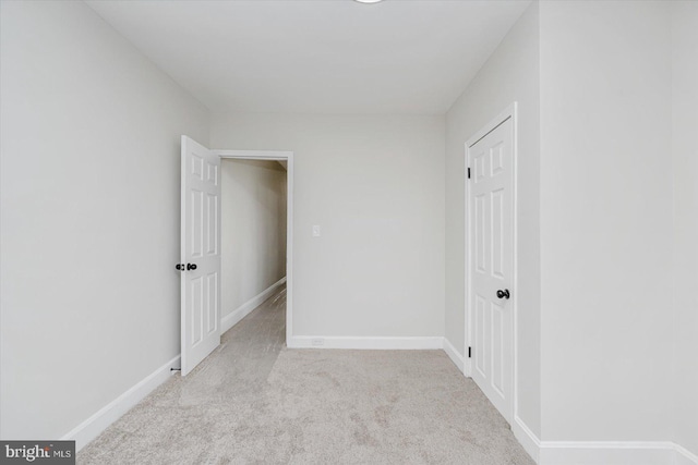 interior space featuring light carpet