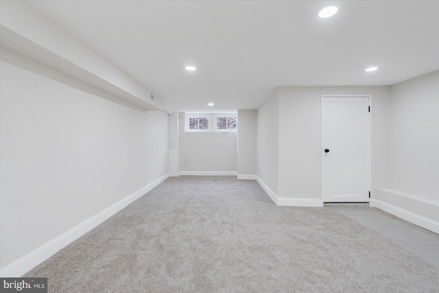 basement with light colored carpet