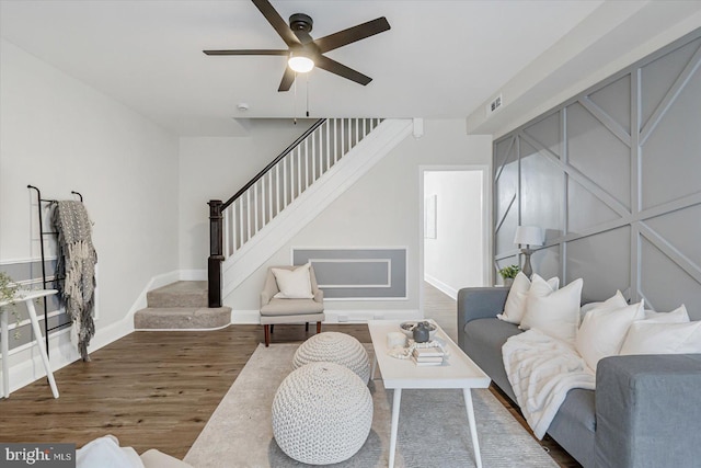 living room with hardwood / wood-style floors and ceiling fan