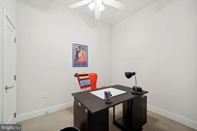 carpeted home office with ceiling fan