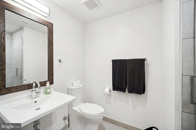 bathroom featuring sink and toilet