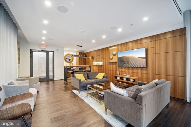 living room with dark hardwood / wood-style flooring