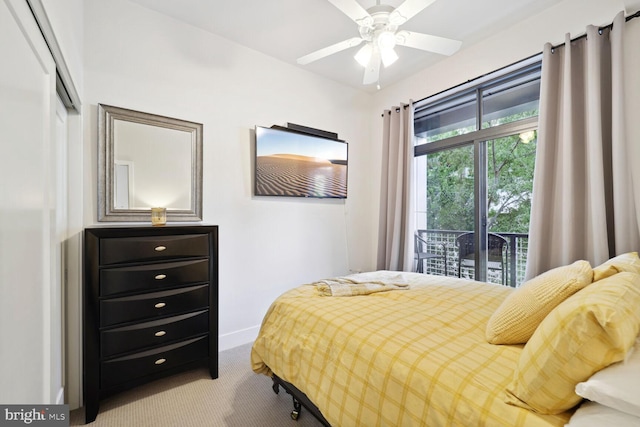 bedroom featuring access to exterior and carpet floors