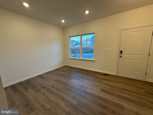 empty room featuring dark hardwood / wood-style floors