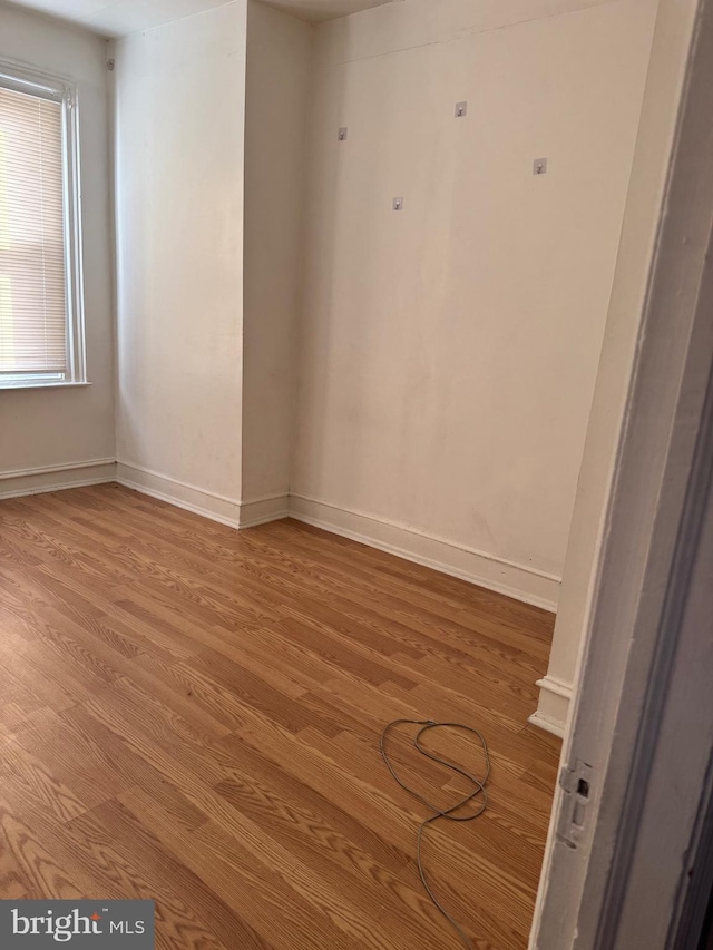 empty room featuring wood-type flooring