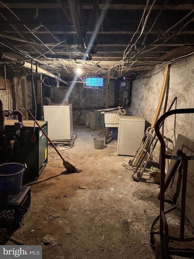 basement with washer / dryer and fridge