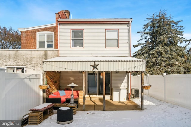 back of property with central AC unit