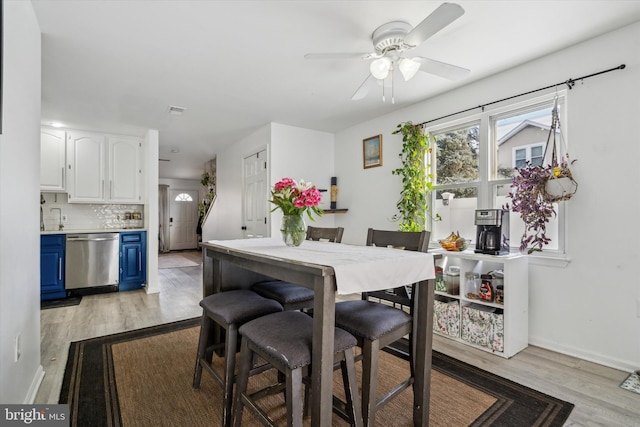 dining room featuring ceiling fan and light hardwood / wood-style flooring