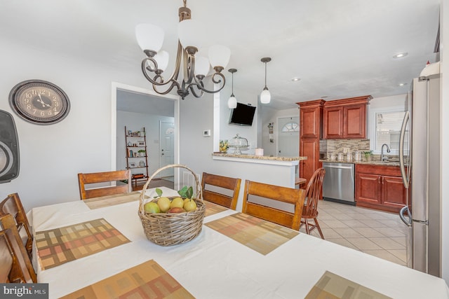 dining room with light tile patterned floors, a chandelier, and recessed lighting