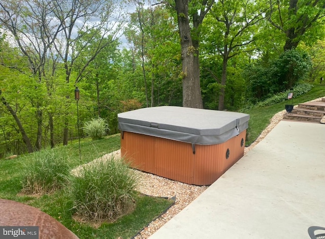 exterior space with a hot tub