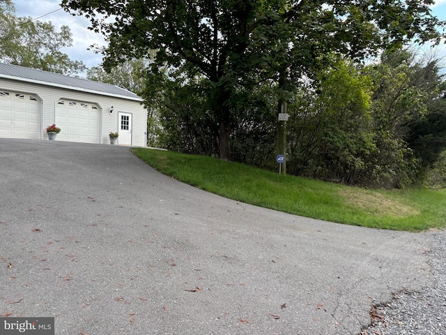 garage featuring a yard