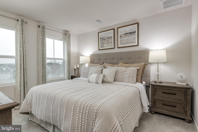 bedroom with light carpet