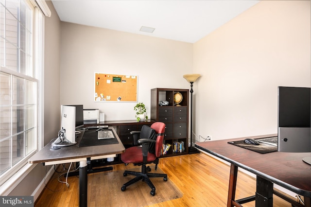 office space with hardwood / wood-style flooring