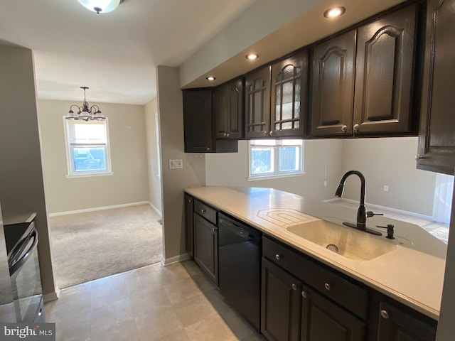 kitchen featuring sink, dark brown cabinets, hanging light fixtures, and dishwasher