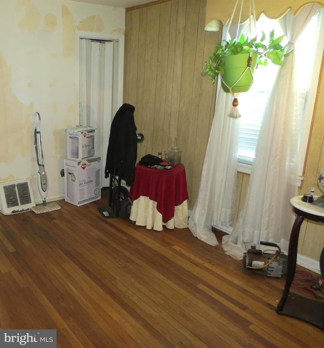 miscellaneous room featuring dark wood-type flooring