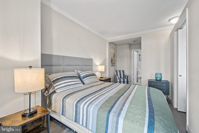 bedroom with ornamental molding and dark wood-type flooring