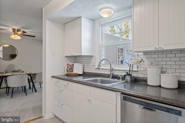 kitchen featuring sink, white cabinetry, a textured ceiling, dishwasher, and backsplash