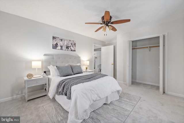 bedroom featuring ceiling fan, light colored carpet, and a closet