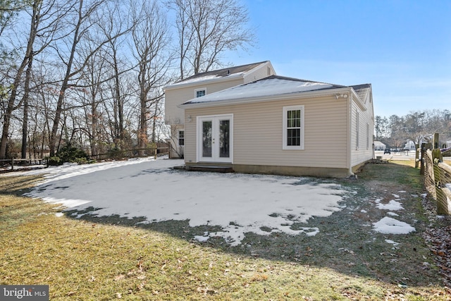 rear view of house featuring french doors