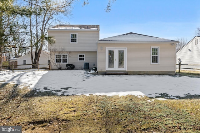 rear view of house featuring french doors and central AC unit