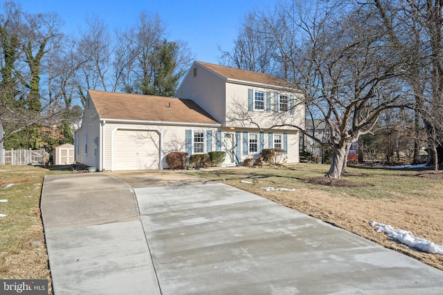 view of front of home featuring a shed, a garage, and a front lawn