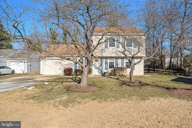 view of front of home with a garage and a front lawn