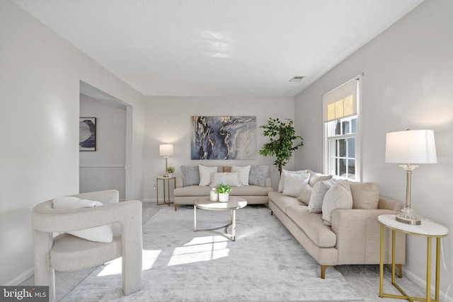 living room featuring light colored carpet