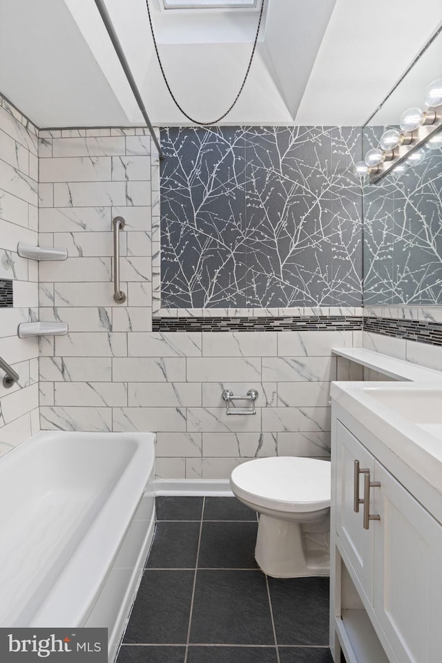 bathroom featuring tile patterned floors, toilet, and vanity