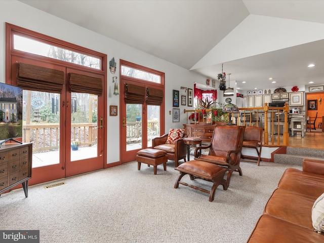 living room with high vaulted ceiling, visible vents, carpet flooring, and recessed lighting