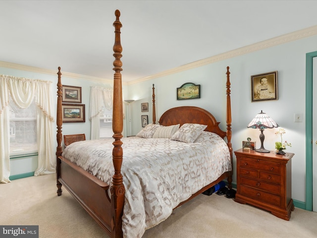 bedroom with crown molding and light colored carpet