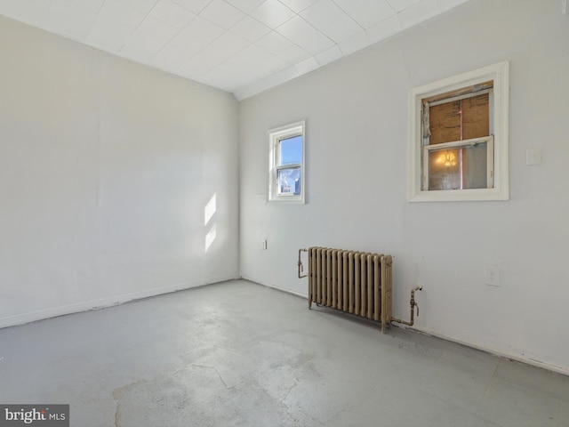 unfurnished room with radiator