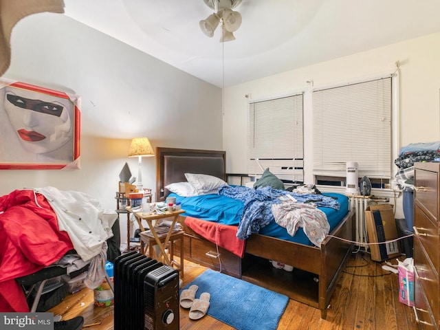 bedroom featuring hardwood / wood-style flooring and ceiling fan