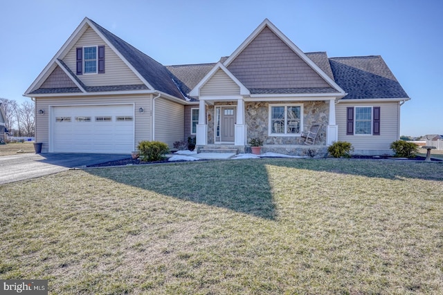 view of front of property with a garage and a front yard