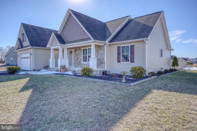 view of front of property with covered porch and a front yard