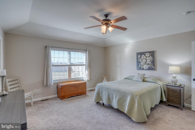 bedroom featuring lofted ceiling, light colored carpet, and ceiling fan