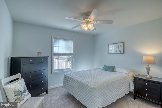 bedroom featuring light colored carpet and ceiling fan