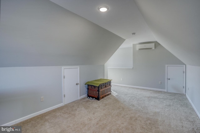 bonus room featuring light carpet, vaulted ceiling, and an AC wall unit