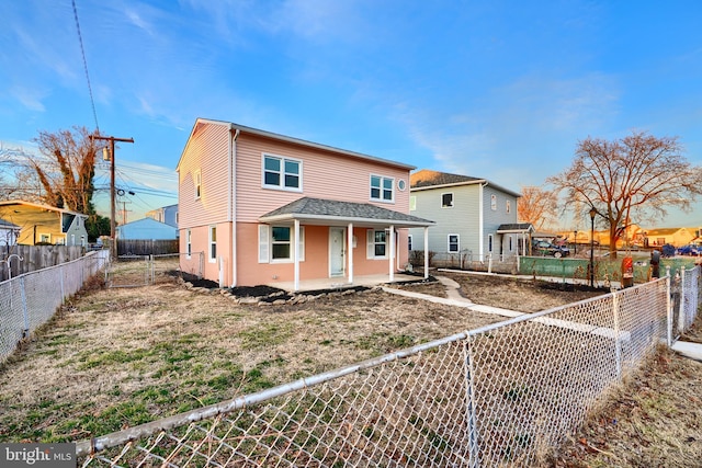 view of front facade featuring a fenced backyard and a patio