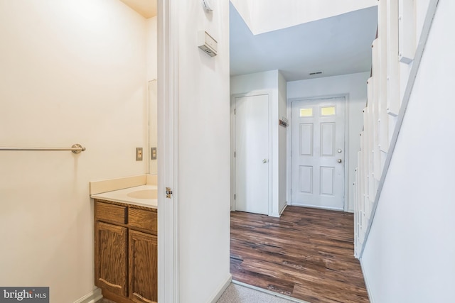 bathroom with hardwood / wood-style flooring and vanity