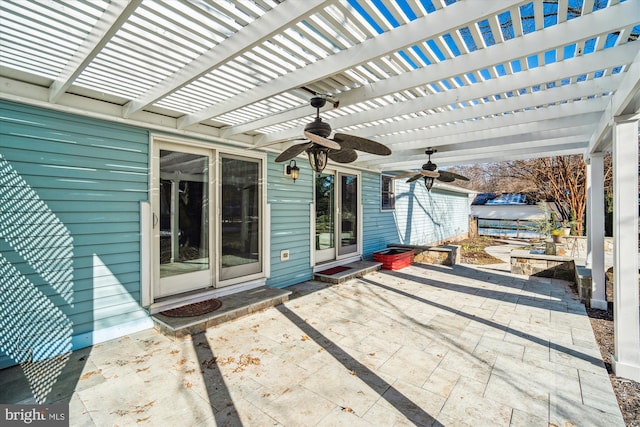 view of patio featuring ceiling fan and a pergola