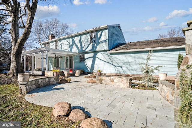 rear view of house featuring a patio, ceiling fan, and a pergola