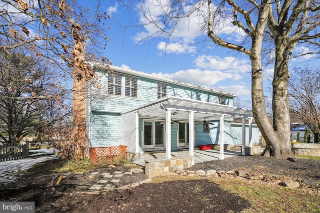 view of front of house with a pergola and a patio area